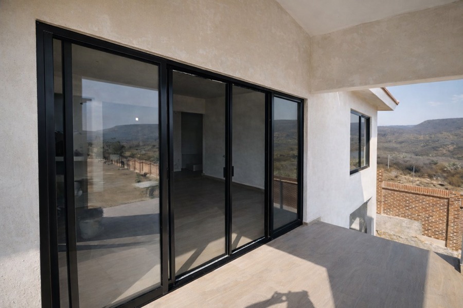 Cancel corredizo en aluminio color negro y cristal claro 6 mm