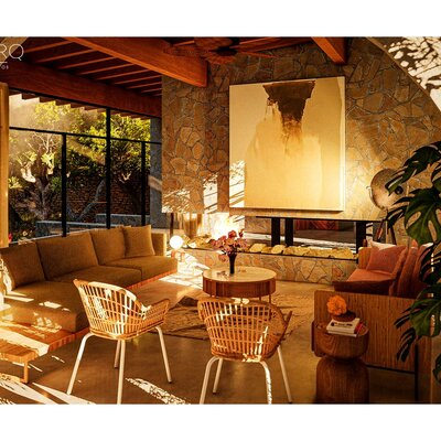 Interior de cabaña contemporánea con acabados en piedra y madera