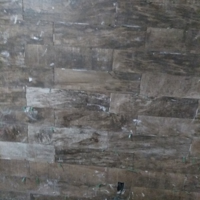Instalación de porcelanato en muro