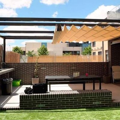 Pergola con velarias corredizas