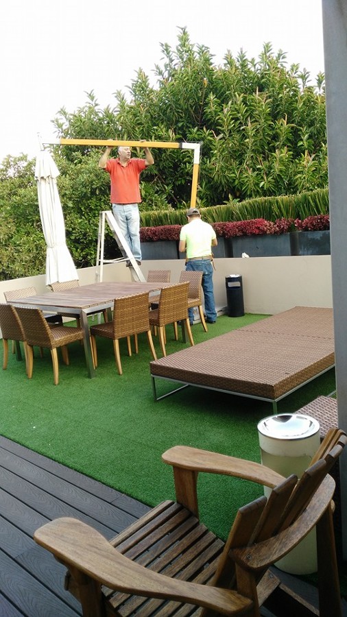 Hechura de y colocación de sombrilla en terraza vip