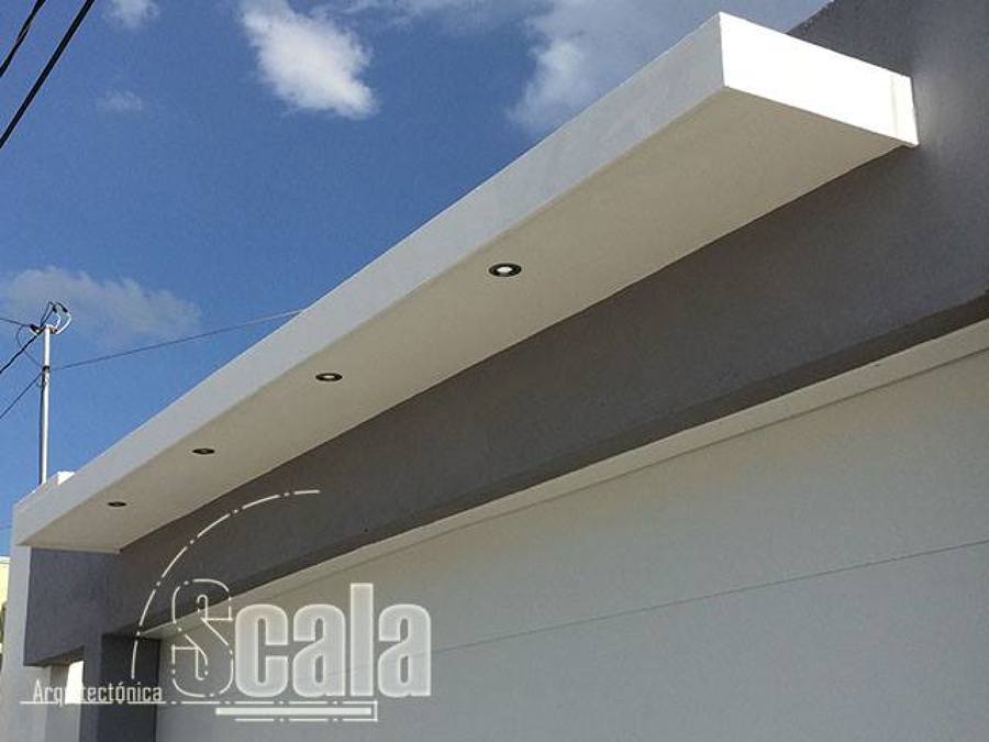 Laminado en cochera y Fachada de panel. 