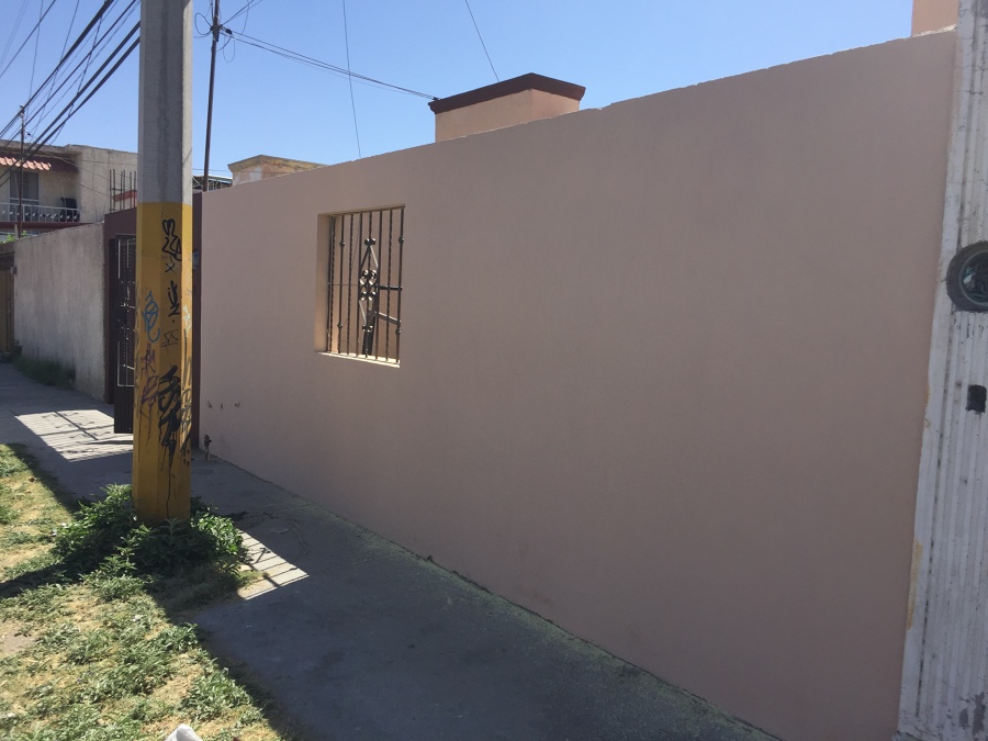 Pintura en fachada de casa