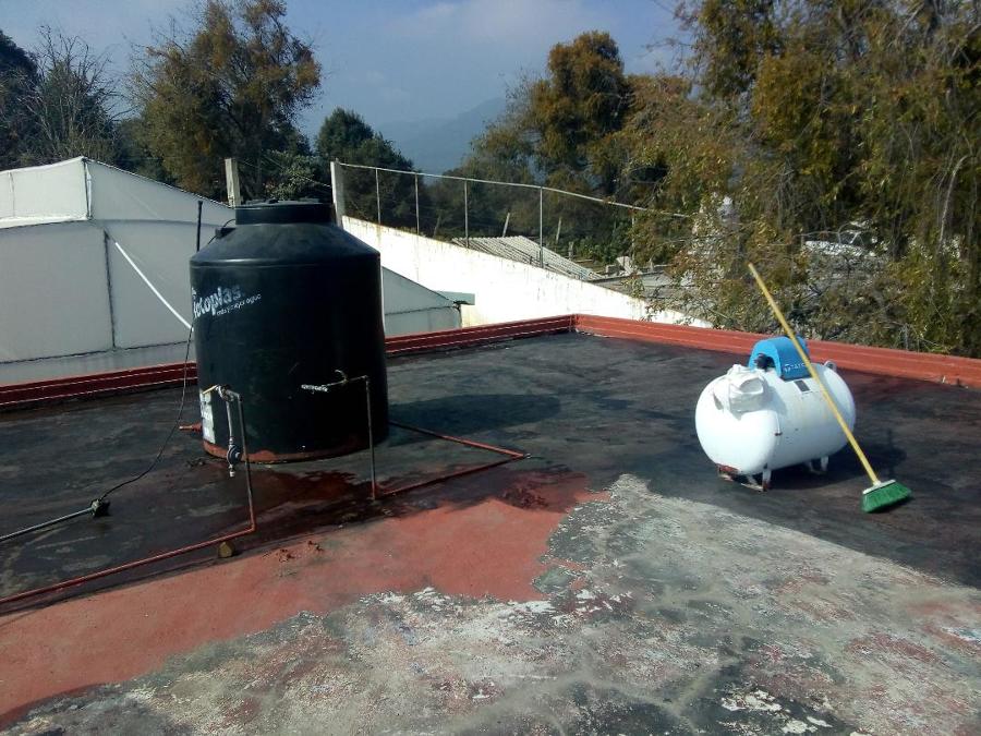 Preparación con material asfaltico