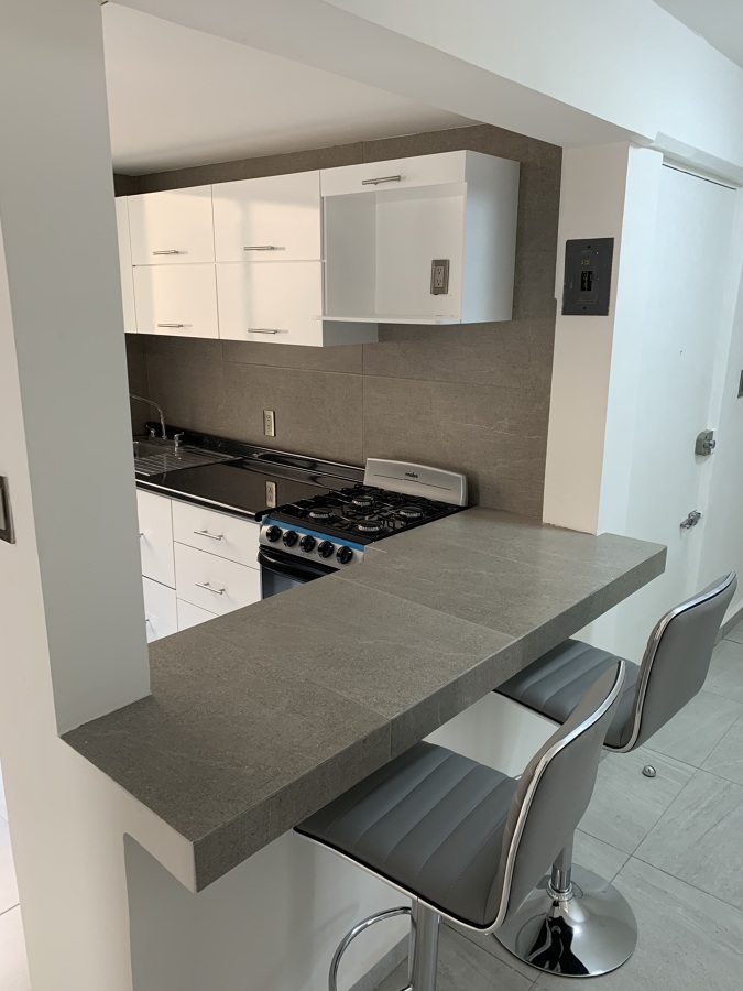 Remodelación departamento moderno - cocina