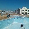Construcción de alberca y área de asoleaderos