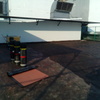 Impermeabilización con Prefabricado Copernit Italiano con gravilla roja en Azotea de Edificio.