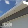 Laminado en cochera y Fachada de panel. 